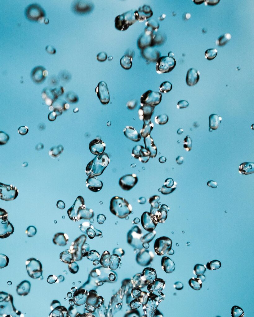 Water bubbles in blue liquid