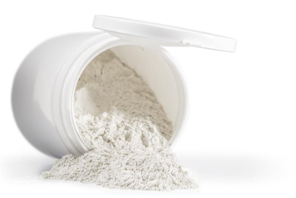 Spilled white powder from an open container, suggesting a product related to health or beauty. Relevant for discussions on supplements or skincare.