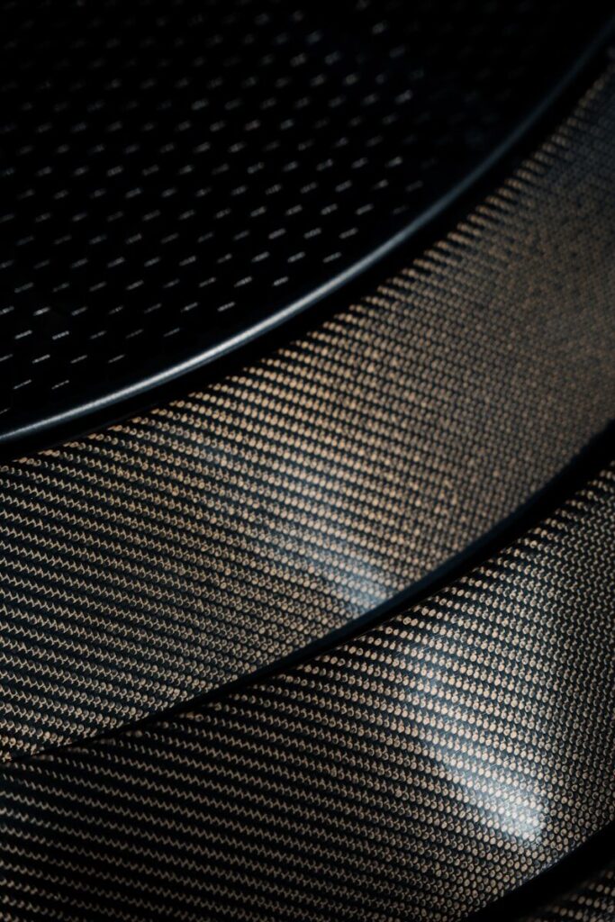 Close-up of a textured carbon fiber surface