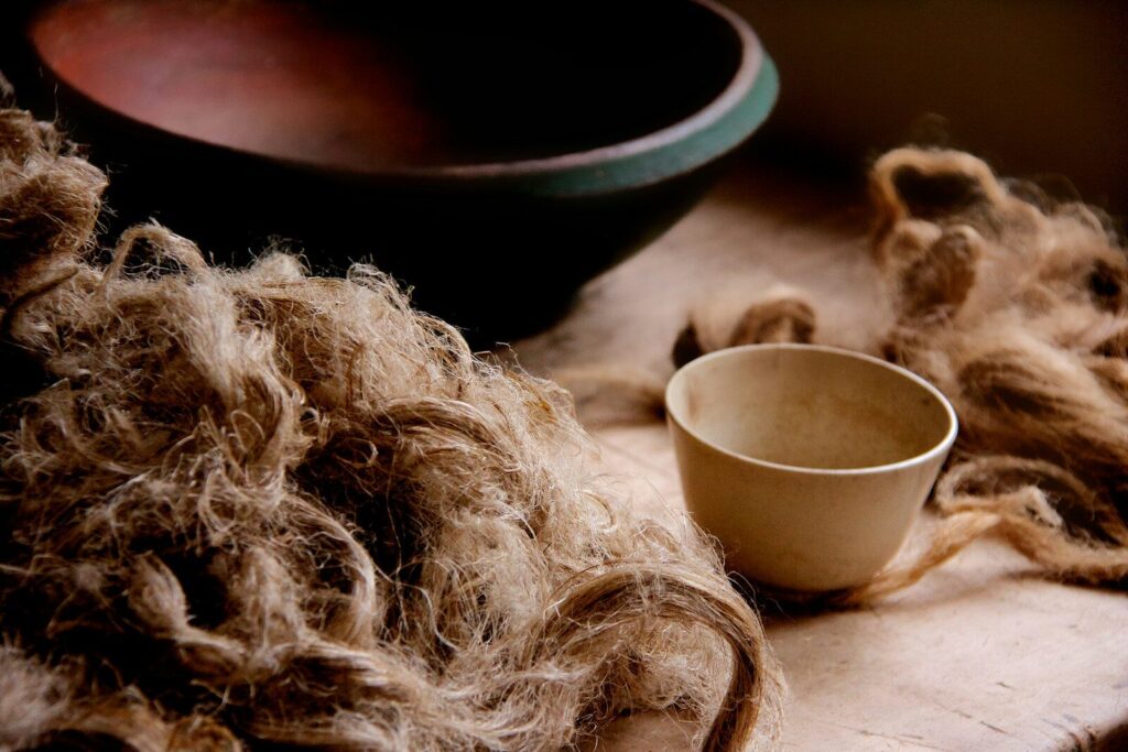 white fur textile beside white ceramic bowl